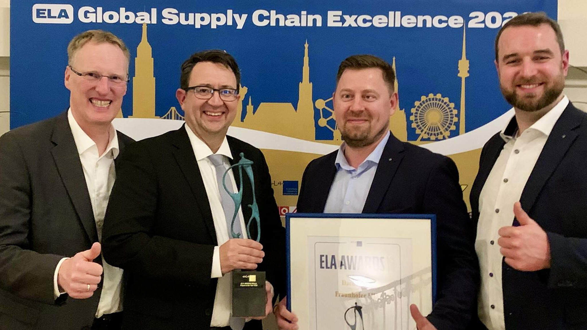 Caption: From left to right: Andre Kranke (Head of Corporate Research & Development at DACHSER), Stefan Hohm (Chief Development Officer at DACHSER), Oleg Belov (research associate at Fraunhofer IML), and Tim Chilla (research associate at Fraunhofer IML) at the ELA Awards ceremony in Vienna.