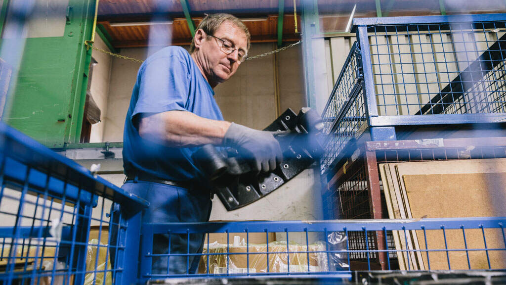 The warehouse staff examines the breaks visually and packs the brakes in wire mesh crates, as standard in the vehicle manufacturing industry